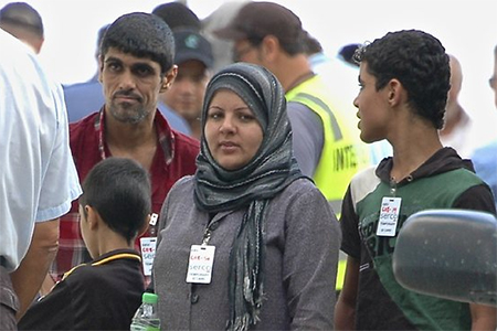 Asylum-seekers disembark at Christmas Island from the latest boat to reach Australian waters