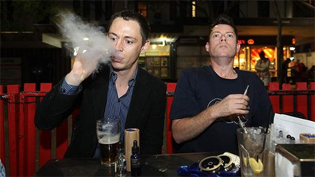 Recharging: Leon Alegria and Damian Duncan enjoy their electronic cigarettes at their local pub