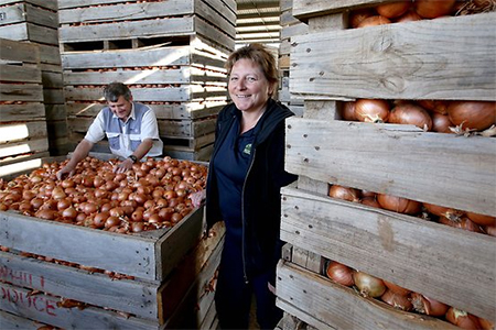 Yvonne Smith with packing shed manager Ian Oosthuizen at her Bowhill property, east of Adelaide. She says she has had to recruit from overseas for skilled workers.